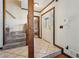 Welcoming entryway with tile flooring, staircase, and natural wood trim throughout at 130 Thornton Dr, Fayetteville, GA 30214