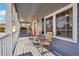 Relax on the inviting covered porch with comfortable seating and classic architectural details at 130 Thornton Dr, Fayetteville, GA 30214