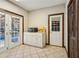 Eat-in kitchen features French doors to the backyard and deck at 130 Thornton Dr, Fayetteville, GA 30214