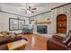 Cozy living room featuring a painted brick fireplace and wood burning insert at 130 Thornton Dr, Fayetteville, GA 30214