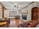 Cozy living room featuring a painted brick fireplace and wood burning insert at 130 Thornton Dr, Fayetteville, GA 30214