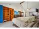 Spacious main bedroom boasts vaulted ceilings, built-in shelving, and a ceiling fan at 130 Thornton Dr, Fayetteville, GA 30214