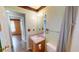Bathroom featuring a sink with vanity, towel rack, and a large mirror at 210 Overview Ct, Villa Rica, GA 30180