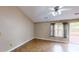 Bright bedroom features tile flooring, ceiling fan, and sliding door access to the outdoor deck at 210 Overview Ct, Villa Rica, GA 30180