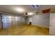 Spacious garage with opener, fan, and shelving on the back wall at 210 Overview Ct, Villa Rica, GA 30180