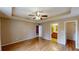 Comfortable bedroom with hardwood flooring leads to ensuite bathroom and hallway access for convenience and privacy at 210 Overview Ct, Villa Rica, GA 30180