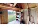 Interior view of storage shed with shelving and a view outside at 210 Overview Ct, Villa Rica, GA 30180