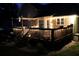 Back deck is illuminated with string lights, creating a relaxing outdoor space at 2193 Kildare Nw Way, Kennesaw, GA 30152