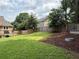 Lawn space with beautiful landscaping and a fenced perimeter at 2193 Kildare Nw Way, Kennesaw, GA 30152