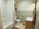 Nicely decorated bathroom featuring a tub and a wooden vanity at 2193 Kildare Nw Way, Kennesaw, GA 30152
