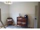 Cozy bedroom with a wood dresser, chair, and decorative wall at 2193 Kildare Nw Way, Kennesaw, GA 30152