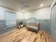 Bedroom with hardwood floors, ceiling fan, crib, play kitchen and window at 2193 Kildare Nw Way, Kennesaw, GA 30152