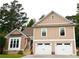 Inviting home with a two-car garage, stairs to the front door, and large bay window offers great curb appeal at 2193 Kildare Nw Way, Kennesaw, GA 30152