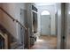 Bright foyer with wood floors, coat rack with bench, and staircase enhances the home's welcoming atmosphere at 2193 Kildare Nw Way, Kennesaw, GA 30152