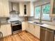 Modern kitchen with stainless steel appliances and granite countertops at 2193 Kildare Nw Way, Kennesaw, GA 30152