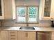 Bright kitchen features white cabinets, granite counters, and stainless steel appliances at 2193 Kildare Nw Way, Kennesaw, GA 30152