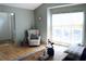 Relaxing living area with comfortable seating, hardwood floors, natural light, and neutral paint for comfort at 2193 Kildare Nw Way, Kennesaw, GA 30152