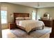 Comfortable main bedroom featuring a wood bed frame and matching wood nightstand at 2193 Kildare Nw Way, Kennesaw, GA 30152