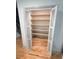 Spacious pantry with open shelves for organized storage and frosted glass doors to hide clutter at 2193 Kildare Nw Way, Kennesaw, GA 30152
