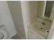 A bathroom with a toilet, vanity, sink, and mirror offers functionality and comfort at 3263 Mill Springs Circle Northeast Cir, Buford, GA 30519