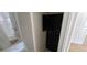 This is a bathroom with a tub and shower combo plus a tall dark cabinet for toiletries and towels at 3263 Mill Springs Circle Northeast Cir, Buford, GA 30519