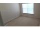 Cozy bedroom with neutral carpet, a window letting in natural light, and fresh white walls at 3263 Mill Springs Circle Northeast Cir, Buford, GA 30519
