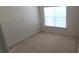 Cozy bedroom featuring neutral carpet, light walls, and a window for natural light at 3263 Mill Springs Circle Northeast Cir, Buford, GA 30519