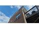 Exterior view of the brick building with a balcony under a clear sky at 3263 Mill Springs Circle Northeast Cir, Buford, GA 30519