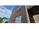 Beautiful brick two-story house featuring a small balcony with a peek of a neighboring property at 3263 Mill Springs Circle Northeast Cir, Buford, GA 30519
