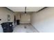 Spacious garage with a concrete floor, overhead door, and ample room for storage at 3263 Mill Springs Circle Northeast Cir, Buford, GA 30519