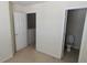 A hallway with two doorways, one leading to a bedroom and one to a toilet room at 3263 Mill Springs Circle Northeast Cir, Buford, GA 30519