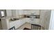 The spacious kitchen featuring white appliances, a countertop sink and breakfast nook at 3263 Mill Springs Circle Northeast Cir, Buford, GA 30519