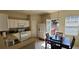 Bright kitchen with white cabinets, dining area, and access to a deck at 3263 Mill Springs Circle Northeast Cir, Buford, GA 30519