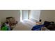 Bright room with large windows, neutral carpet, and a sliding door with access to the backyard at 3263 Mill Springs Circle Northeast Cir, Buford, GA 30519