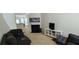 A cozy living room complete with fireplace, mantle, staircase and a television at 3263 Mill Springs Circle Northeast Cir, Buford, GA 30519