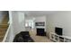 Cozy living room features a fireplace and staircase leading to the upper level at 3263 Mill Springs Circle Northeast Cir, Buford, GA 30519