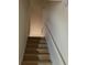 Carpeted stairway leading to the upper level of the home at 3263 Mill Springs Circle Northeast Cir, Buford, GA 30519