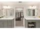 Bright bathroom with dual sinks, modern fixtures, and a doorway leading to the bedroom at 3275 Lord N Lady Ln, Alpharetta, GA 30022