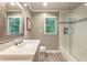 Bathroom featuring a modern vanity, wood-look flooring, and a shower-tub combo at 3275 Lord N Lady Ln, Alpharetta, GA 30022