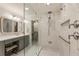 Well-lit bathroom featuring a glass shower with marble tiling and a view of a walk-in closet at 3275 Lord N Lady Ln, Alpharetta, GA 30022