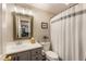Neutral bathroom featuring a new vanity, shower and a large framed mirror at 3275 Lord N Lady Ln, Alpharetta, GA 30022