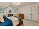 Comfortable bedroom with carpet, complemented by two windows and a double door closet at 3275 Lord N Lady Ln, Alpharetta, GA 30022