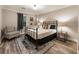 Cozy bedroom featuring natural light, a metal frame bed and neutral walls at 3275 Lord N Lady Ln, Alpharetta, GA 30022
