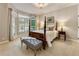Comfortable bedroom with bay window and lots of natural light at 3275 Lord N Lady Ln, Alpharetta, GA 30022