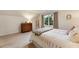 Bedroom featuring carpet, a dresser, and a window with backyard views at 3275 Lord N Lady Ln, Alpharetta, GA 30022