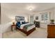 Cozy bedroom with carpet, complemented by two windows and warm natural light at 3275 Lord N Lady Ln, Alpharetta, GA 30022