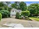 Charming home featuring a well-maintained yard and long private driveway at 3275 Lord N Lady Ln, Alpharetta, GA 30022