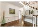 Welcoming foyer with hardwood floors, staircase, and decorative accents at 3275 Lord N Lady Ln, Alpharetta, GA 30022