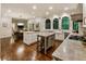 Large open-concept kitchen with white cabinets, hardwood floors, stone countertops, eat-in area and great natural light at 3275 Lord N Lady Ln, Alpharetta, GA 30022