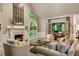 Bright living room features a fireplace, high ceilings, and access to an outdoor space at 3275 Lord N Lady Ln, Alpharetta, GA 30022